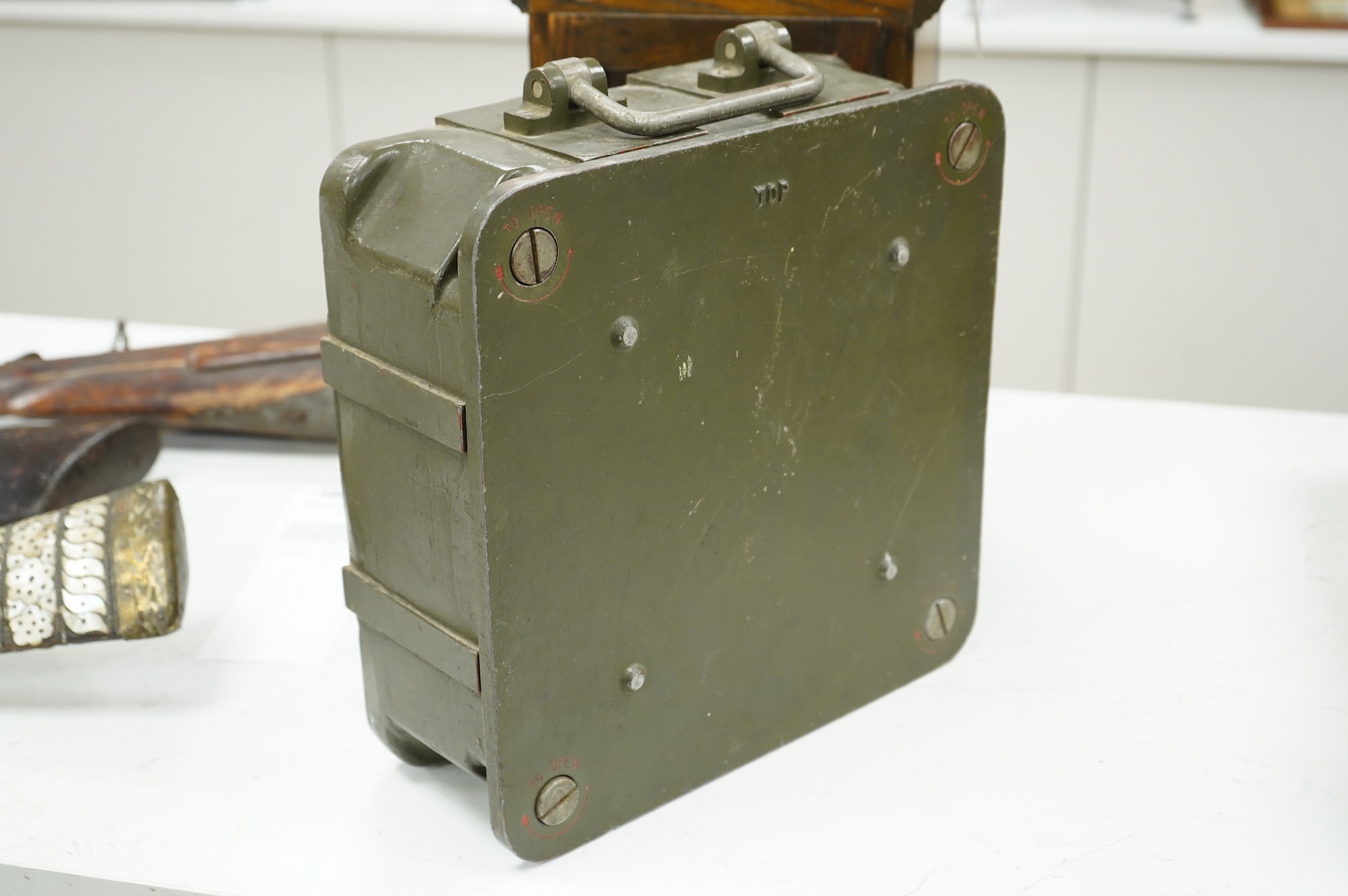 A British military Astral Smiths eight day signal clock, housed in a metal alloy case with detachable cover, 29 x 29 x 12cm